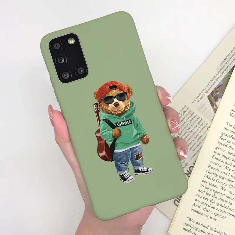 a person holding a book and a phone case