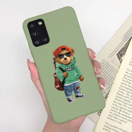 a person holding a book and a phone case