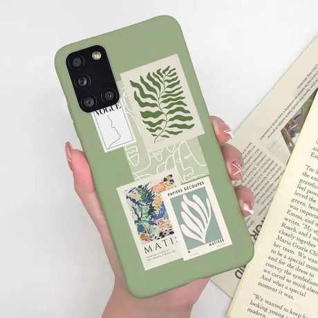 a woman holding a book and a phone case