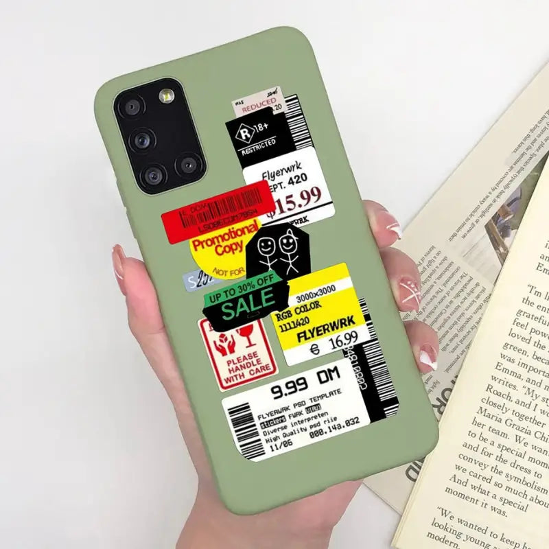 a person holding a book and a phone case