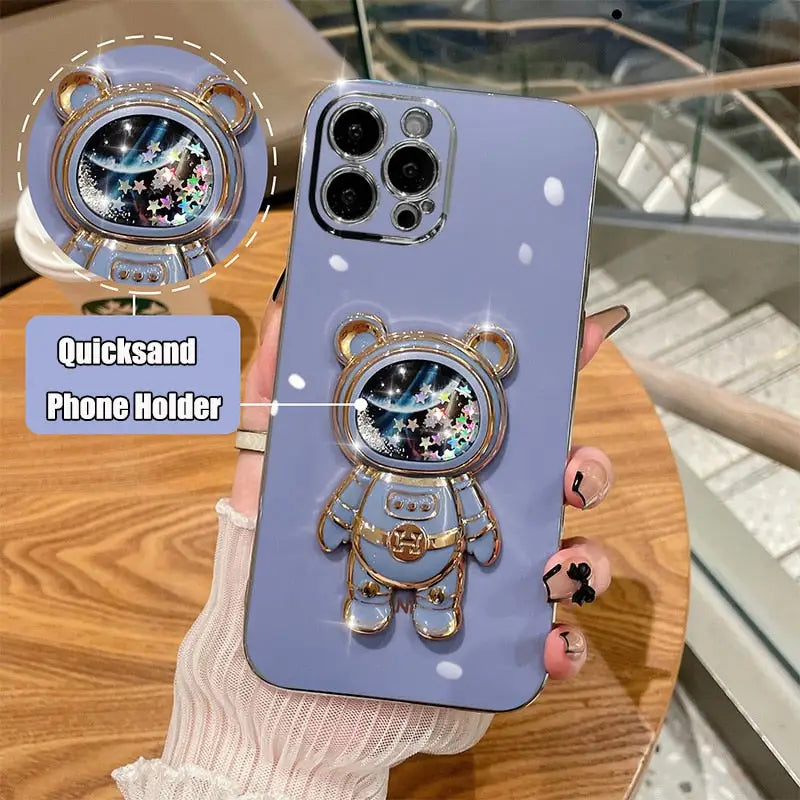 a person holding a phone case with a picture of an astronaut