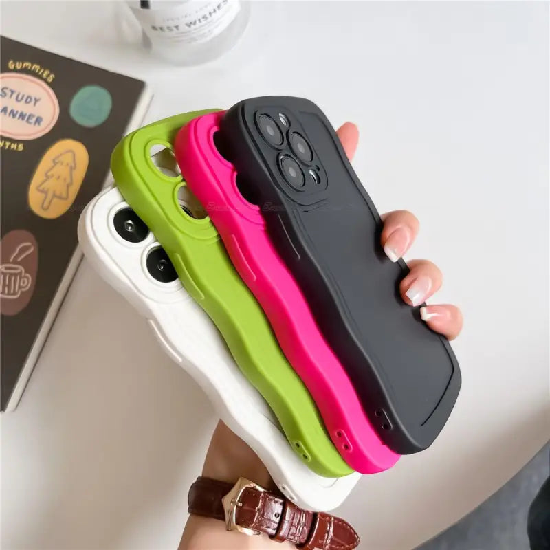 a person holding a phone case with a camera