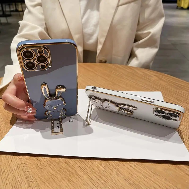 a person holding a phone with a key on it