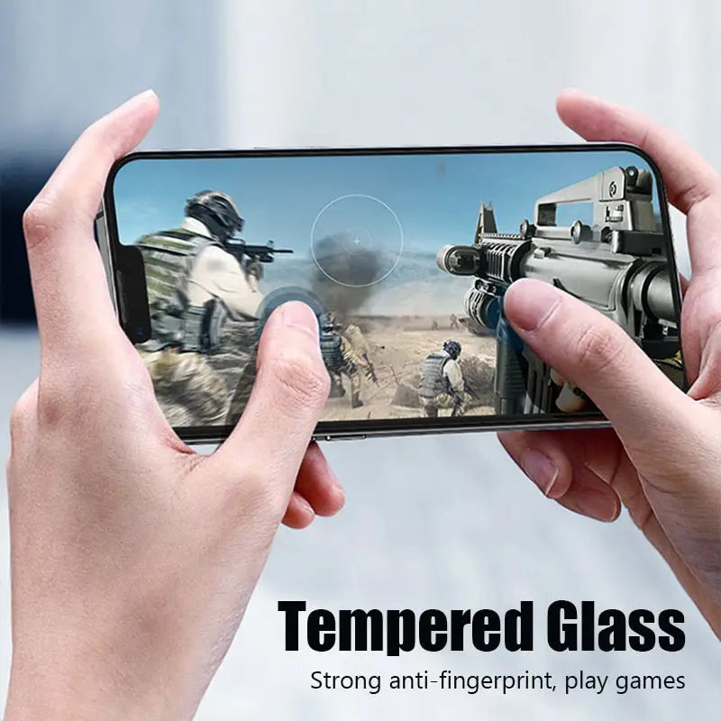 a person holding a phone with the text tempered glass