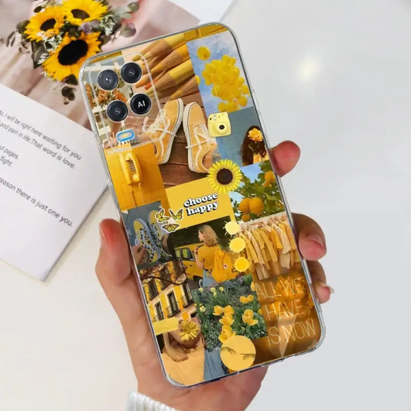 a person holding a phone with a yellow flower