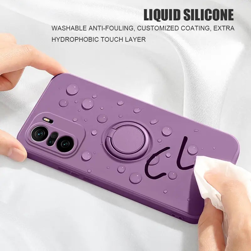 a person holding a purple phone case