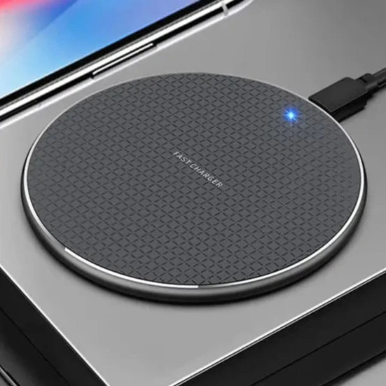 a person holding a wireless device with a charging pad attached to it