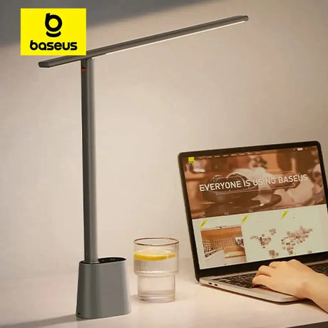 A person using a laptop on a desk