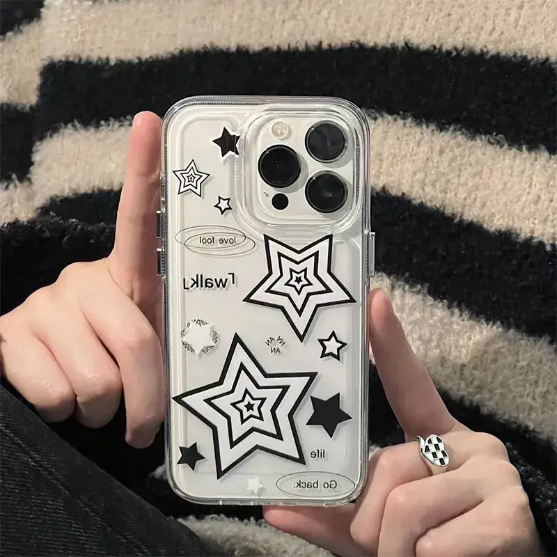 A person holding a phone case with a star design