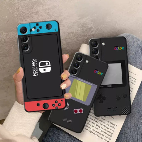A person holding a phone case with a video game controller on it