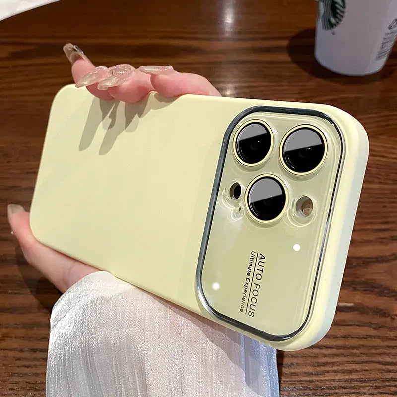 a person holding a yellow iphone case