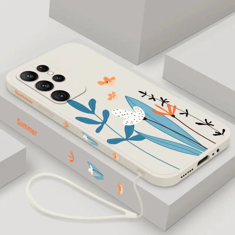 a phone case with a bird and flowers on it