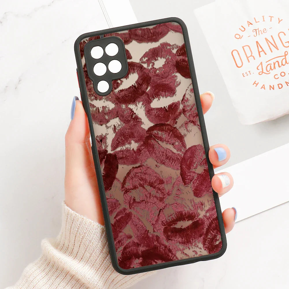 Back side of a samsung galaxy line art design phone case with black border and deep red lipstick smudge pattern on translucent background