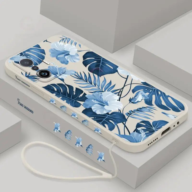A phone case with blue flowers on it