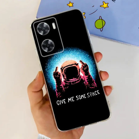 a person holding a phone case with a spaceman on it