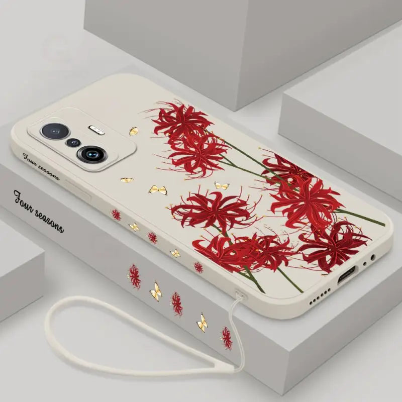 A phone case with red flowers on it