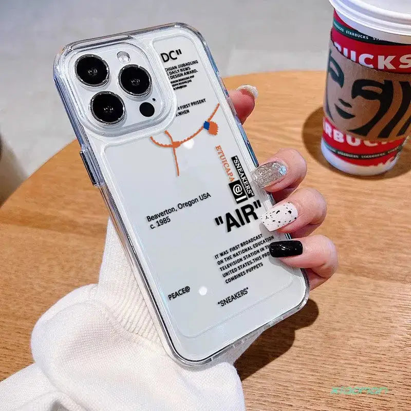 Someone holding a phone case with a sticker on it