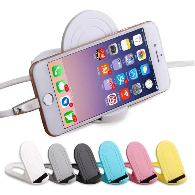 a close up of a cell phone with a charging dock attached