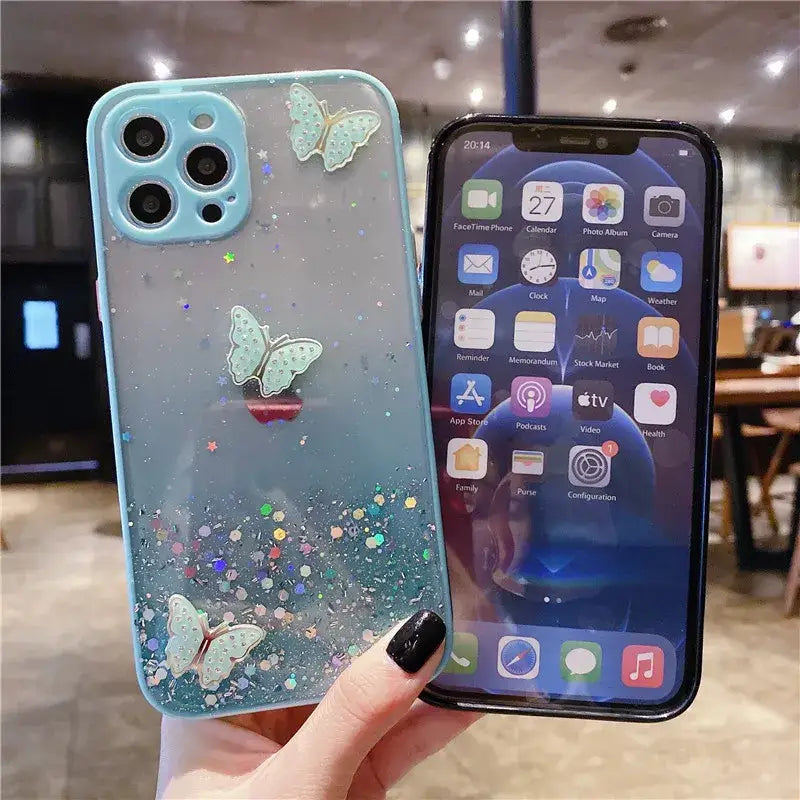 Someone holding a phone with a glitter case on it