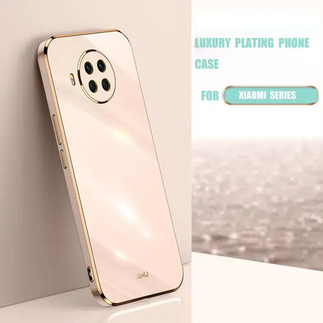 a phone with a gold case on it