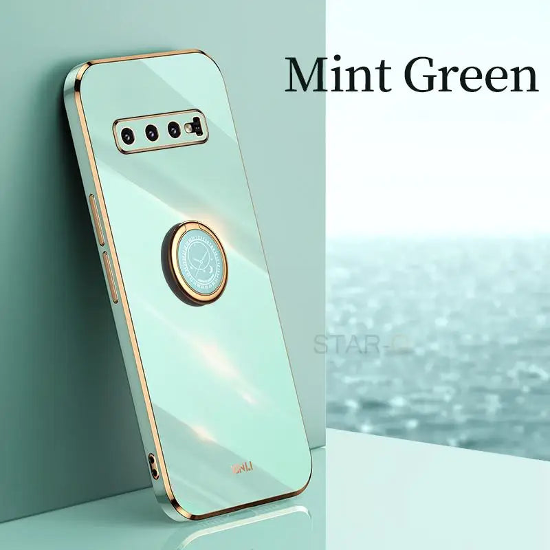a phone with a gold case on it