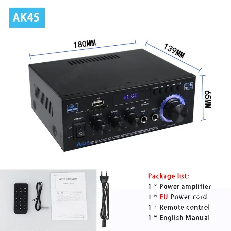 A picture of a black amplifier with a remote control and a box