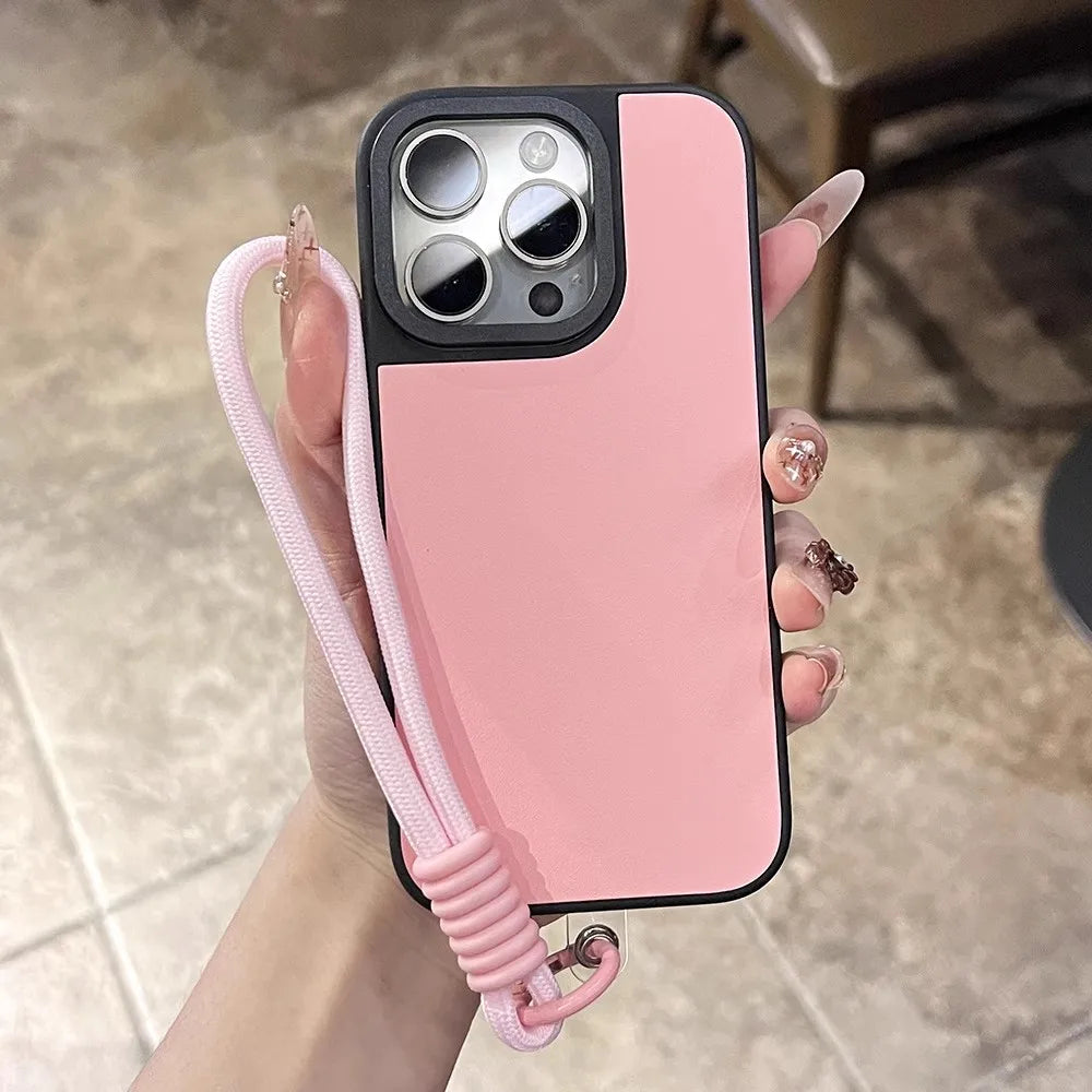 Pink and black phone case with lanyard.