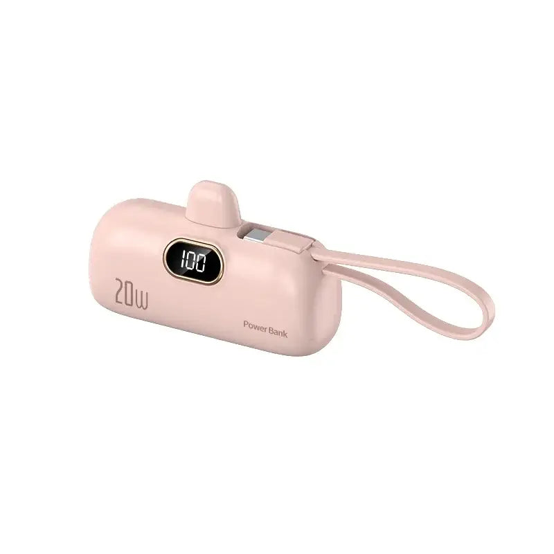 a pink camera with a strap