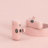 a pink earphone with a charging unit