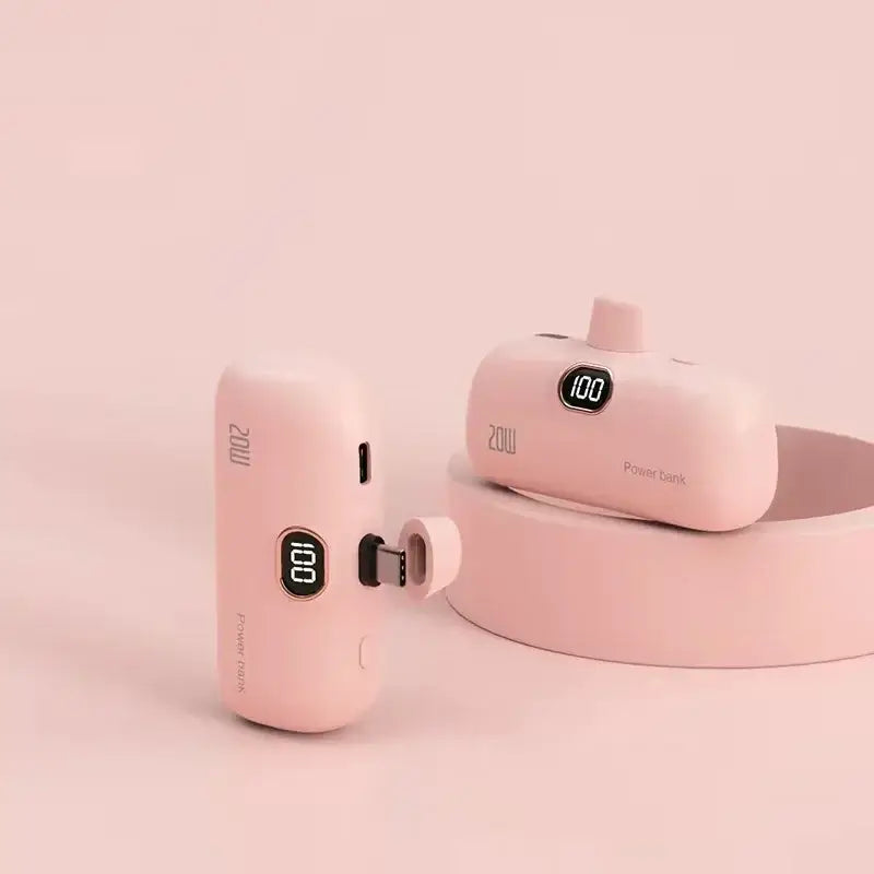 a pink earphone with a charging unit