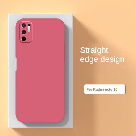 a pink phone case sitting on top of a white box