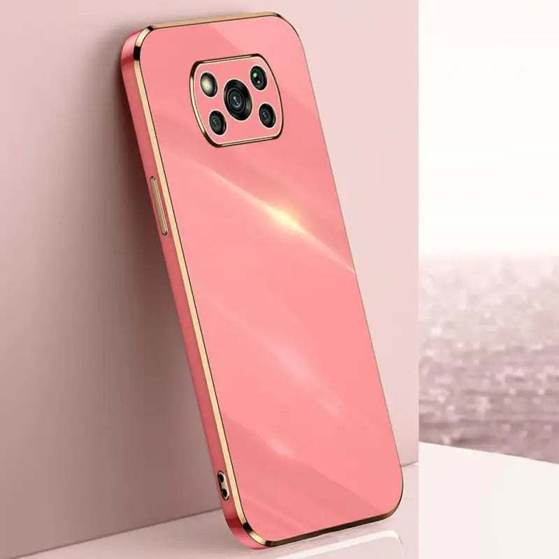 a pink iphone case with a gold frame