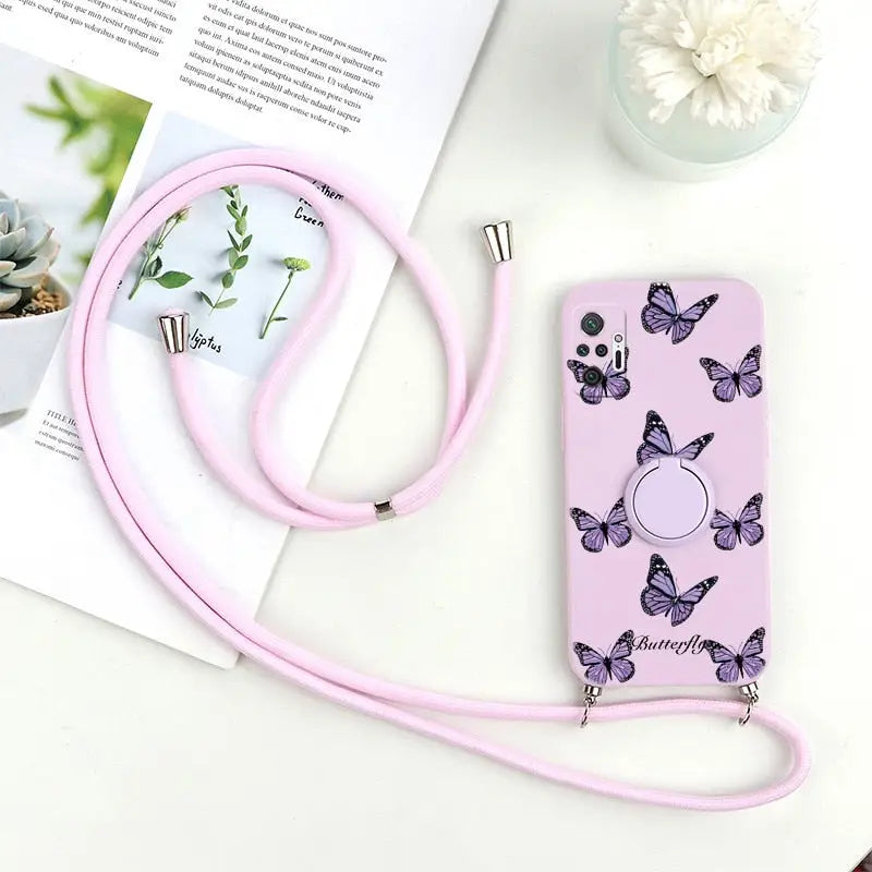 a pink phone case with butterflies on it