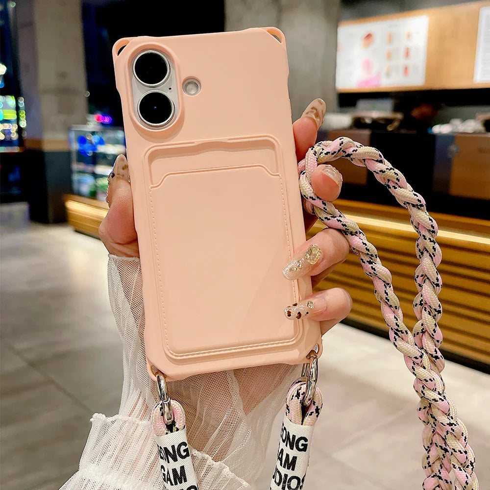 Pink phone case with card holder and braided strap.