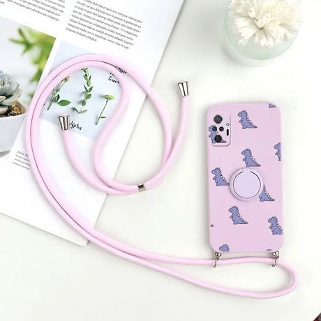 a pink phone case with a cat design on it