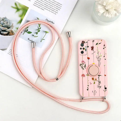 a pink phone case with a floral design