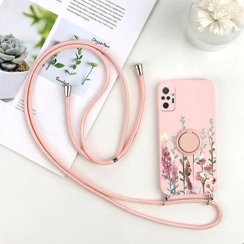 a pink phone case with a flower design on it