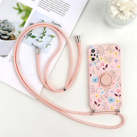 a pink phone case with a flower pattern on it