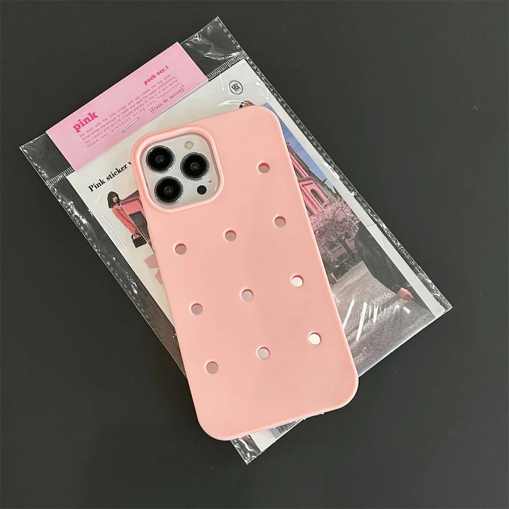 Pink phone case with holes.