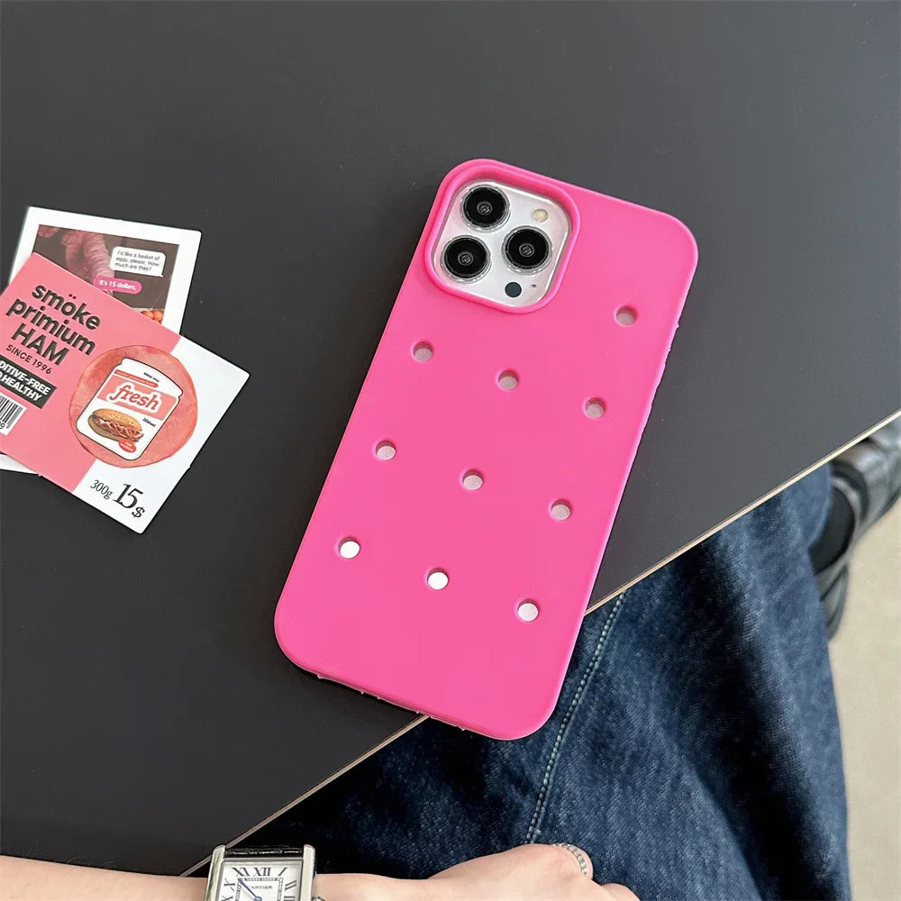 Pink phone case with holes.