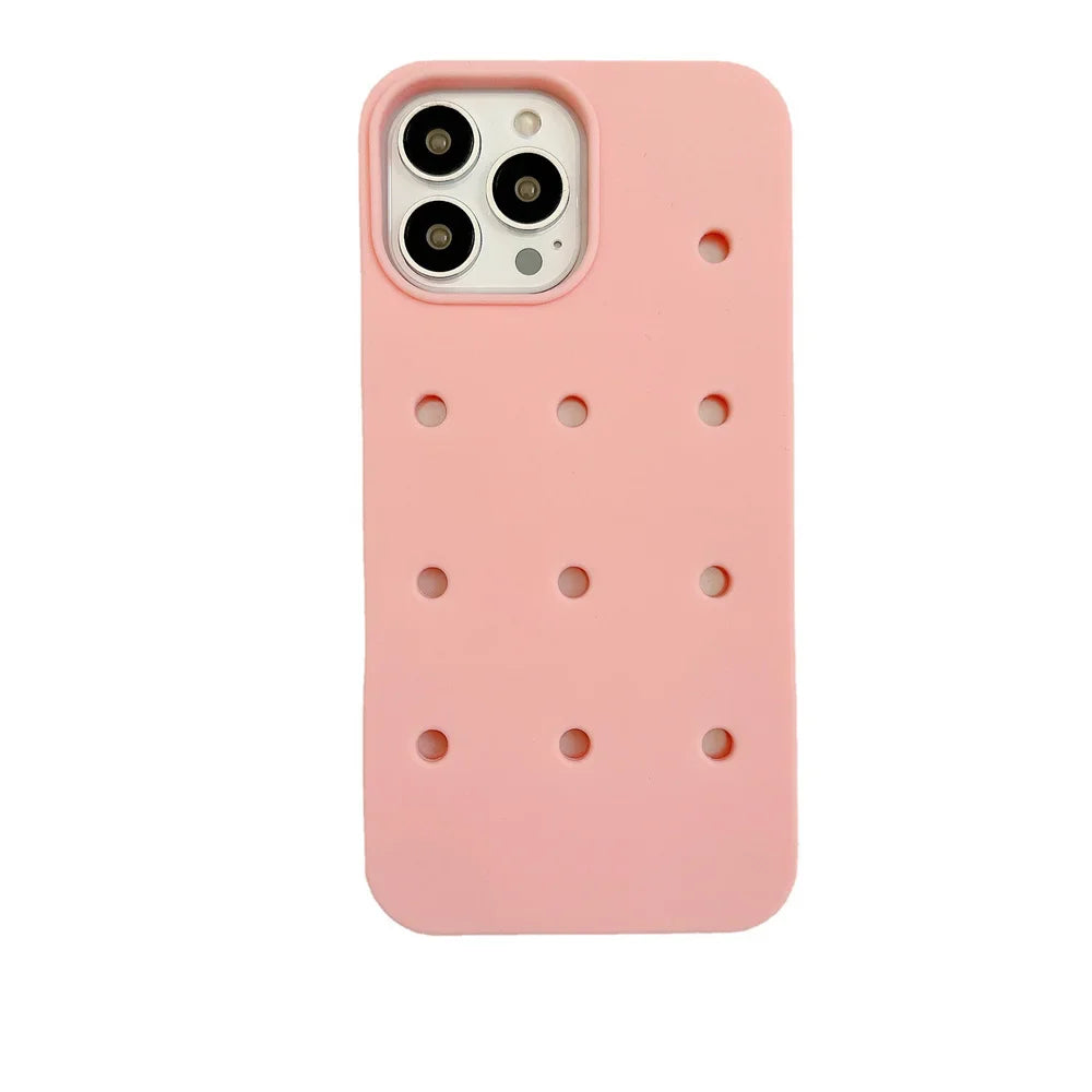 Pink phone case with holes.