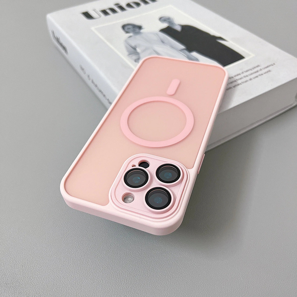 Pink phone case with MagSafe ring.