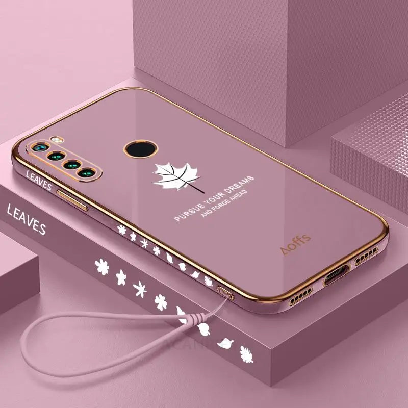 a pink phone case with a white maple leaf design