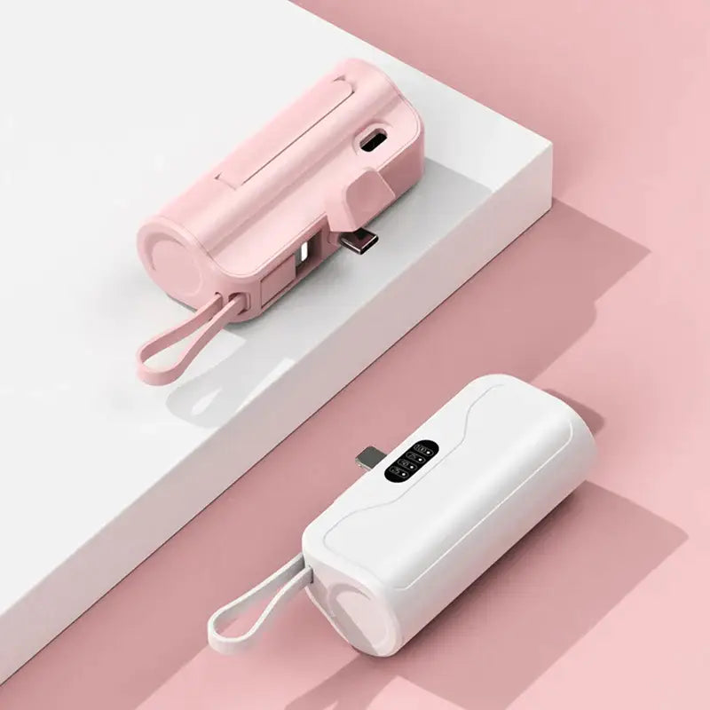 a pink power bank with a white power bank on top