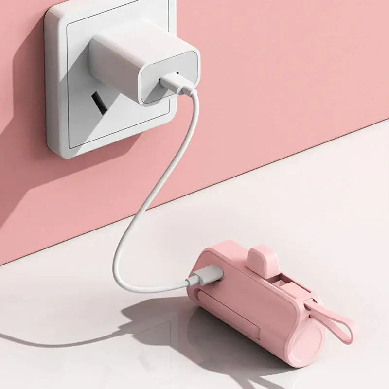 there is a pink and white electrical outlet with a pink wall