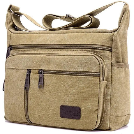 the canvas bag is a large, tan colored bag with a zipper closure