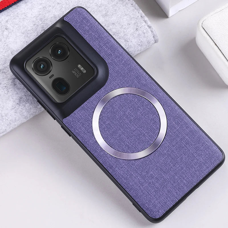 Purple fabric phone case with a black camera module and a silver magnetic ring.