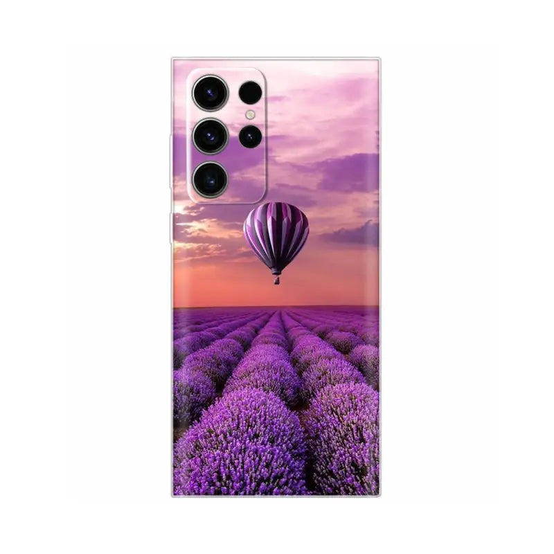 a lavender field with a hot air balloon in the sky