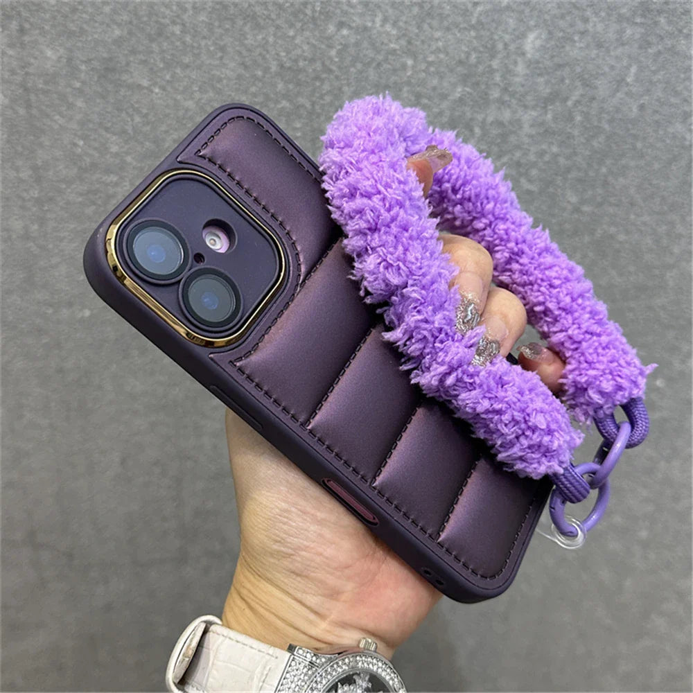 Purple quilted phone case with fuzzy handle.