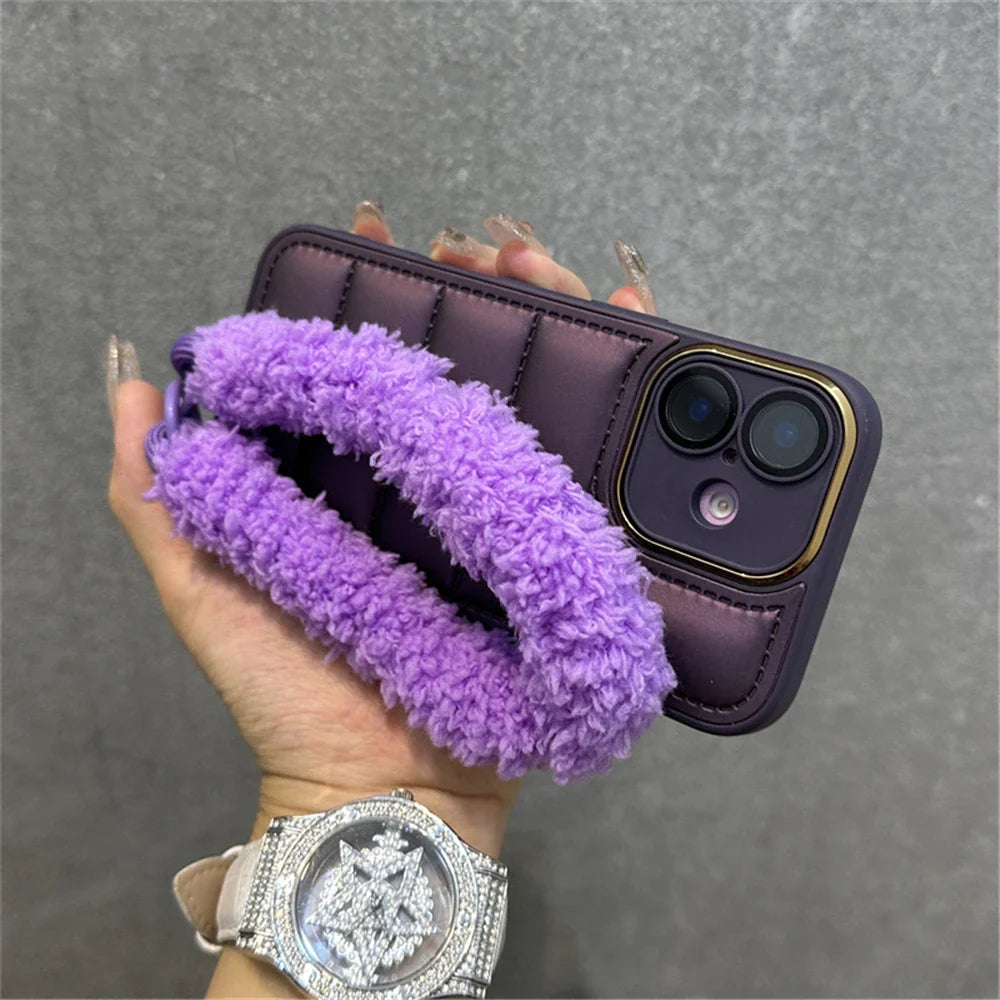 Purple quilted phone case with fuzzy strap.